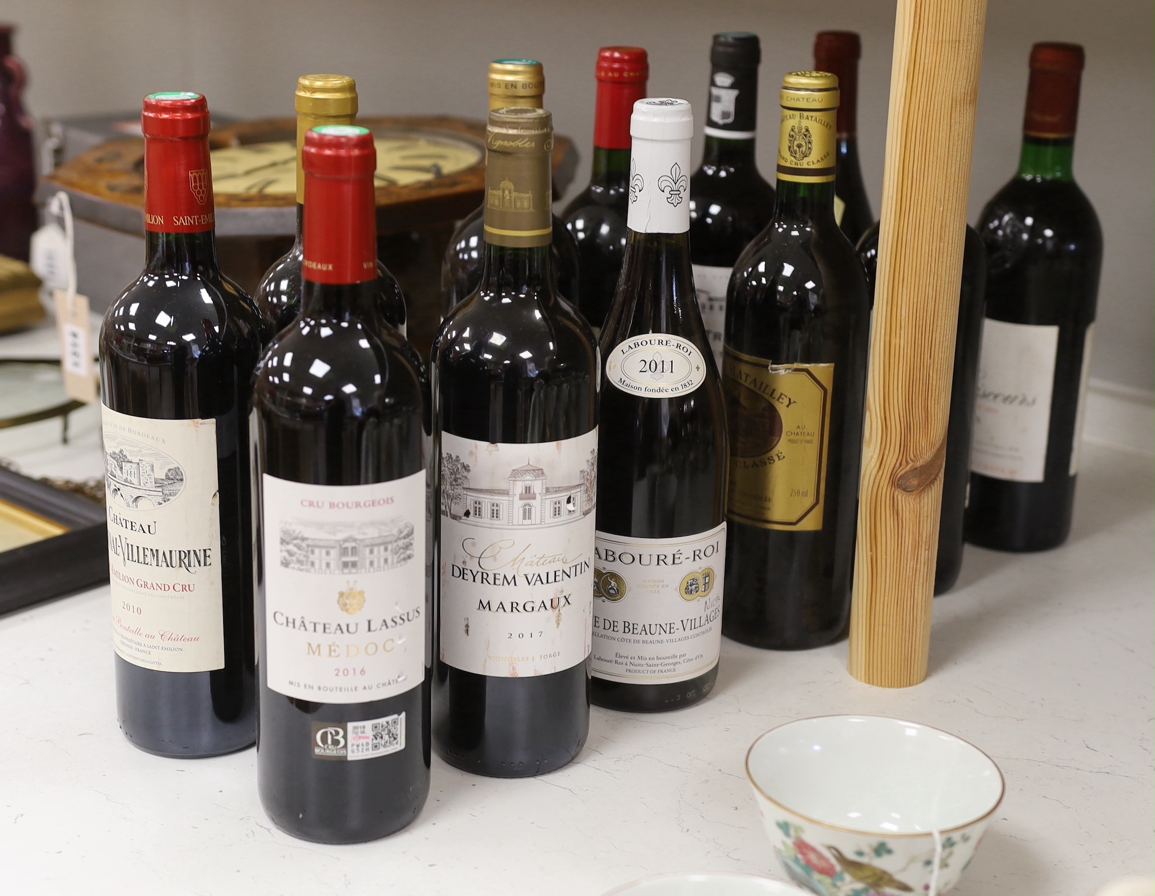 Twelve bottles of wine including Margaux Chateau Giscours 1975, Margaux Chateau Deyrem Valentin 2017, Saint Emilion Chateau Chante Alouette 2010 Grand Cru, Saint Emilion Chateau Villemaurine 2010 Grand Cru